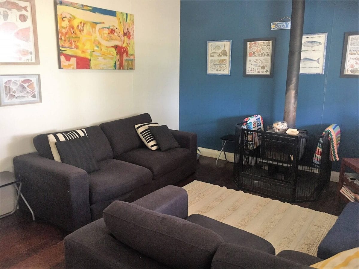 Weekender - Accommodation in Bremer Bay - 21 Barbara Street. Loungeroom has 3 seater and 2 seater couches, TV, DVD and fireplace